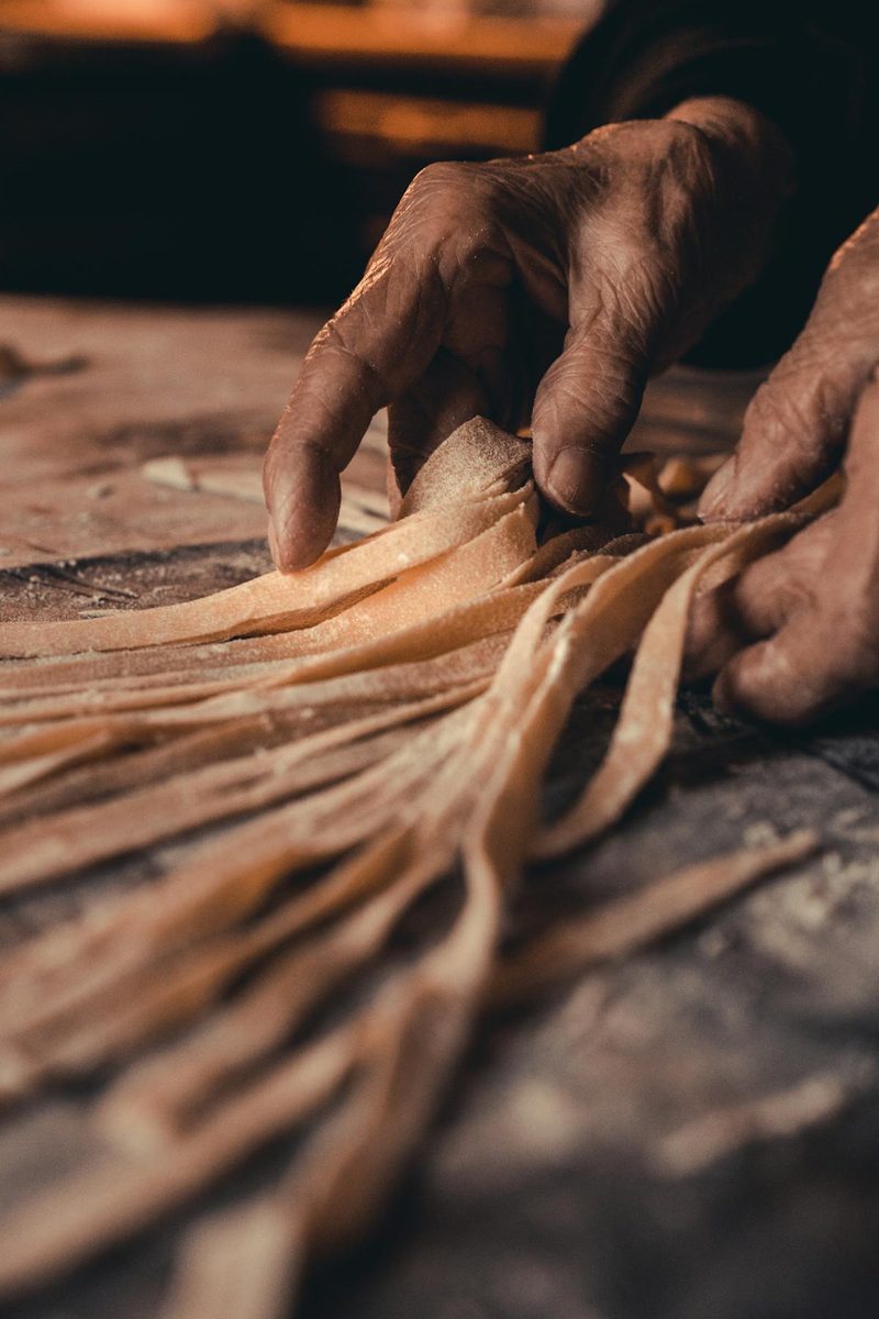 Display of freshly made uncooked pasta varieties