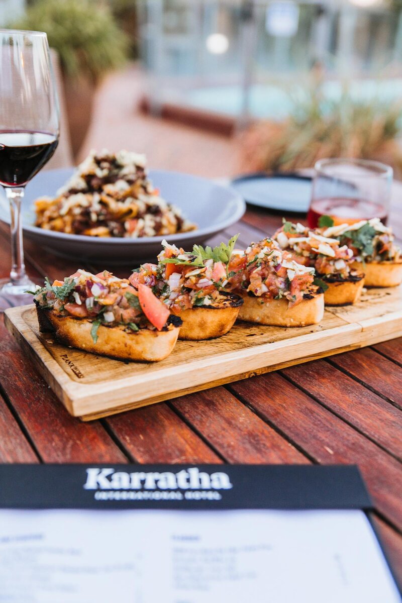 Italian bruschetta served aperitivo-style at a dining table